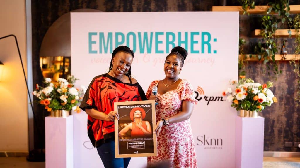 Wahu holding a Lifetime Achievement award at her anniversary celebration.